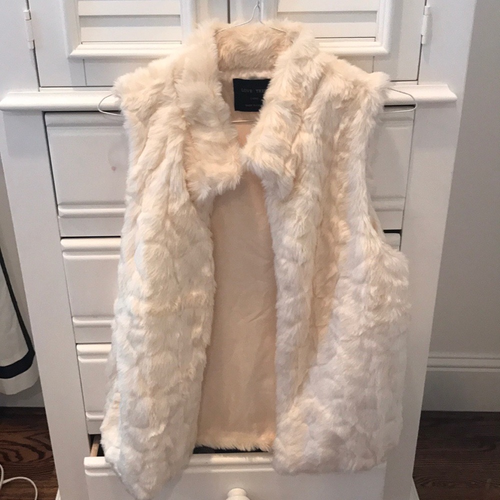 White fur vest